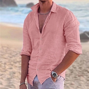 Detail of men's pink linen long sleeve beach shirt featuring breathable fabric texture