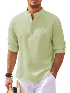 Detailed texture of light green waffle knit fabric on casual long sleeve Henley shirt