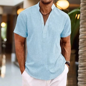 Close-up of light blue cotton linen shirt with textured fabric and small stand-up collar