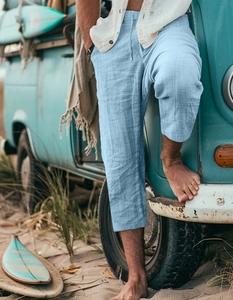 Detail of light blue linen-textured shorts with drawstring waist for summer beach vacation