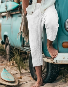 Detailed close-up of white drawstring elastic waistband on linen casual shorts