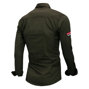 Close-up of military green cotton shirt back with brand patch on the sleeve