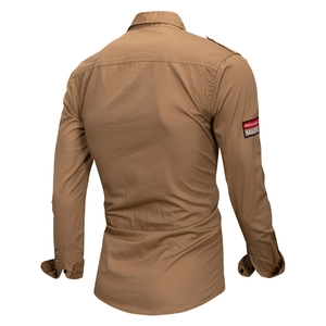 Detail of khaki military shirt showing shoulder epaulets and sleeve brand patch