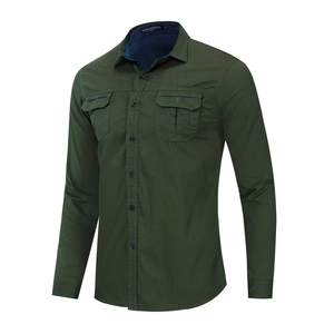 Detail of army green military shirt featuring double chest pockets and button-down collar