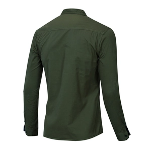 Detail view of the back yoke and stitching on a dark green military style cotton shirt