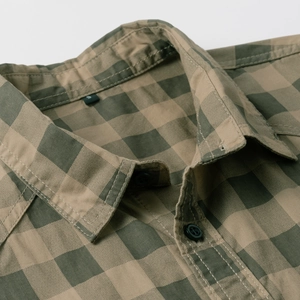 Close-up of checkered cotton shirt collar with size S label and neat button details
