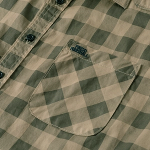 Detail of the logo embroidery on the chest pocket of this plaid cotton long sleeve shirt