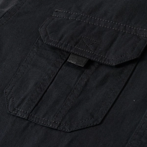 Detail of cargo pocket with double-needle stitching on 100% cotton black shirt
