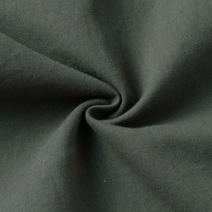 Close-up of dark grey-green cotton twill fabric showing fine woven texture and drape