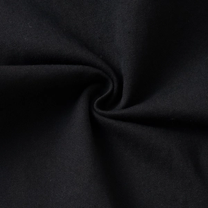 Macro detail of high-quality black 100% cotton canvas fabric with twill texture for shirts