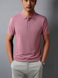 Men's casual polo shirt in dusty rose with classic collar and short sleeves in studio light