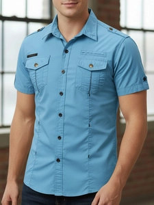 Detail of lake blue slim fit shirt featuring shoulder epaulettes and double chest pockets