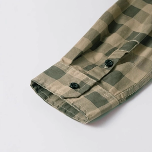 Men's olive green and khaki plaid cotton shirt featuring buttoned cuffs and fine stitching