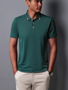 Men's slim fit dark green short sleeve polo shirt with tricolor striped collar detail