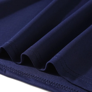 Detail macro shot of navy blue breathable honeycomb mesh fabric with double-stitched hemline