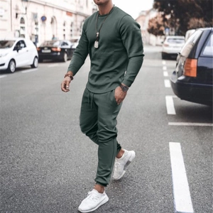 Close-up of army green men's casual two-piece tracksuit with textured fabric