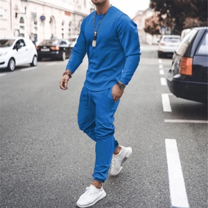 Detail of Klein blue men's casual two-piece tracksuit featuring long sleeve sweatshirt and joggers