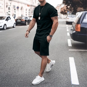 Close-up of black men's casual two-piece tracksuit with t-shirt and drawstring shorts