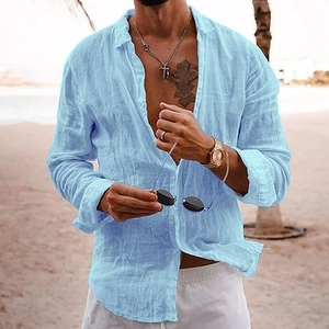 Men's light blue linen long-sleeve shirt in a relaxed summer beach setting