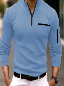 Close-up of light blue long sleeve polo shirt with creative arm zipper and stand collar