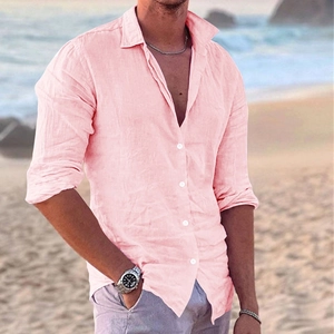 Detail of pink cotton linen shirt showing texture, white buttons and casual beach style