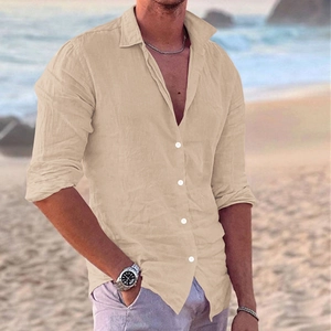 Detail of slim fit men's linen shirt in sand color with classic collar and white buttons