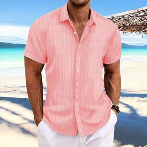 Detail of coral pink striped linen shirt featuring white buttons and textured fabric