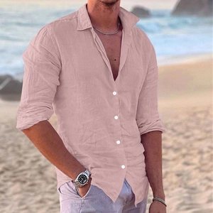 Detail of light pink linen shirt fabric with natural texture and white buttons on a man