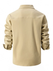 Back view of khaki long sleeve cotton shirt showing shoulder yoke and buttoned cuffs