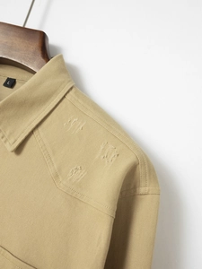 Detail of khaki twill cotton shirt collar with distressed shoulder and size L tag