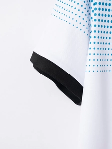 Detail of breathable mesh fabric sleeve with blue gradient dots and black ribbed cuff