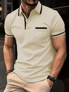 Detailed close-up of a slim fit men's polo shirt with black contrast trim on collar and pocket
