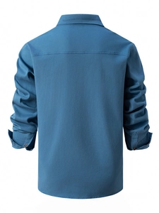 Detailed back view of a men's long sleeve washed cotton shirt in slate blue color