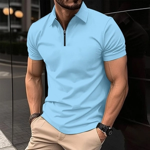 Detail of light blue short-sleeve polo shirt featuring a modern black zipper closure