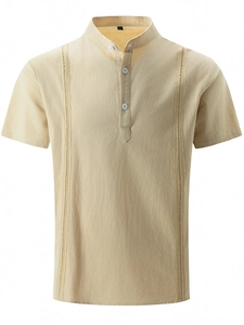 Detail of khaki cotton linen shirt showing Henley collar and vertical embroidery