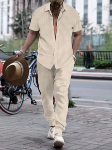 Detail of men's casual beige ribbed short sleeve shirt and trousers set texture