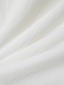 Detailed macro view of white cotton linen fabric texture with natural weave pattern