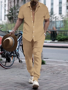 Detail of men's summer khaki lounge set showing textured vertical ribbed fabric and buttons