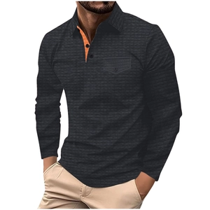Men's dark grey waffle knit long sleeve polo shirt with orange contrast collar detail