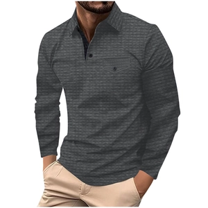 Detail of men's long sleeve polo shirt with textured grid pattern and buttoned chest pocket