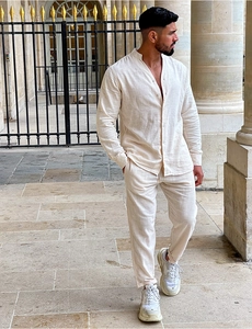 Close-up of beige linen men's casual two-piece set featuring shirt texture and standing collar