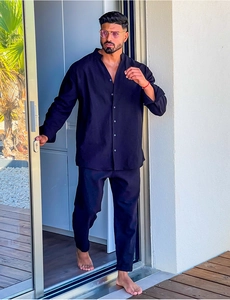 Men's navy cotton linen set featuring long sleeve Henley shirt and trousers on terrace