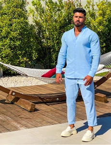 Detail view of light blue linen blend long sleeve shirt and drawstring trousers set