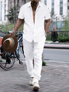 Close-up detail of white short-sleeve shirt with vertical striped texture for men