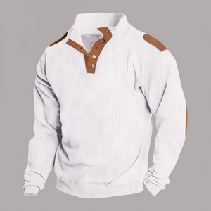 Detail of waffle knit fabric and brown leather-like patches on white Henley polo shirt