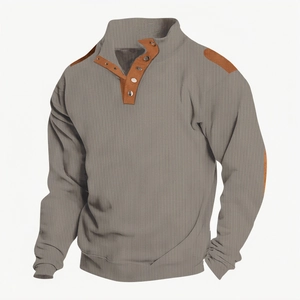 Close-up of grey waffle knit polo shirt showing Henley collar and brown shoulder panels