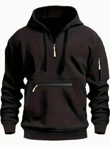 Detail view of men's black hoodie with arm zipper pocket and ribbed cuffs