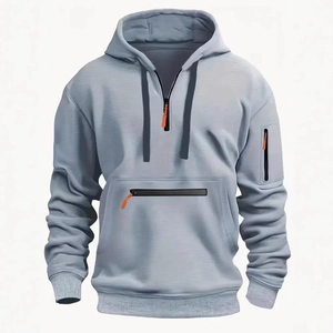 Men's light grey quarter-zip hoodie with orange accents and functional sleeve pocket