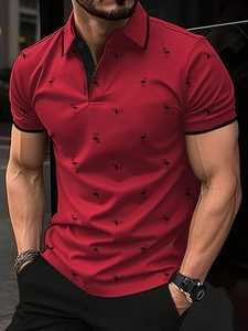 Close-up of red flamingo print polo shirt showing the collar and button details