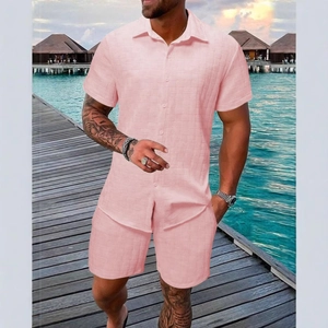 Detailed view of pink textured waffle fabric on men's summer vacation shirt and shorts set
